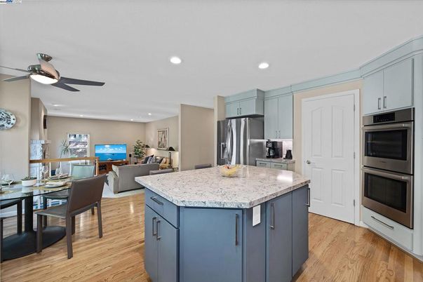Dining room, Interior, Kitchen, Living room, Recessed Lighting, Stainless Steel Appliances, Wood Texture Flooring