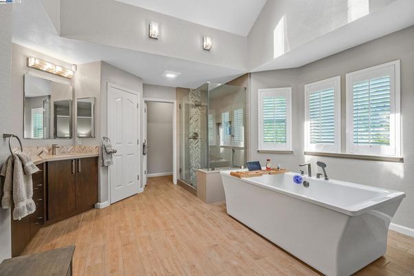 Bathroom, Dual Sink Vanities, Free Standing Baths, Glass Shower, Interior, Wood Texture Flooring