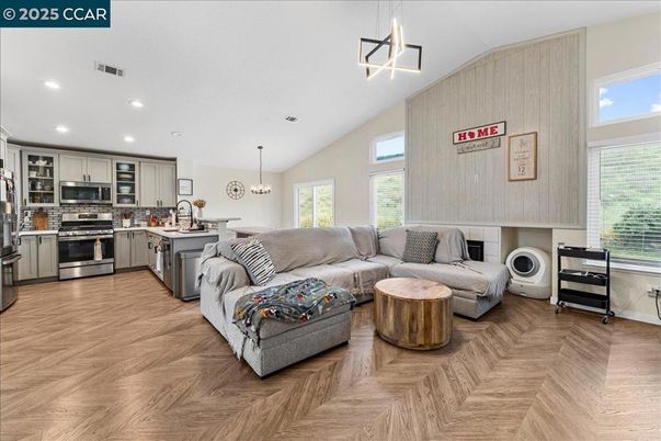 Chandelier, Interior, Kitchen, Living room, Pendant Lights, Recessed Lighting, Stainless Steel Appliances, Wood Texture Flooring