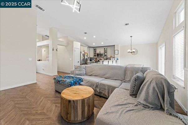 Chandelier, Interior, Kitchen, Living room, Pendant Lights, Recessed Lighting, Stainless Steel Appliances, Wood Texture Flooring