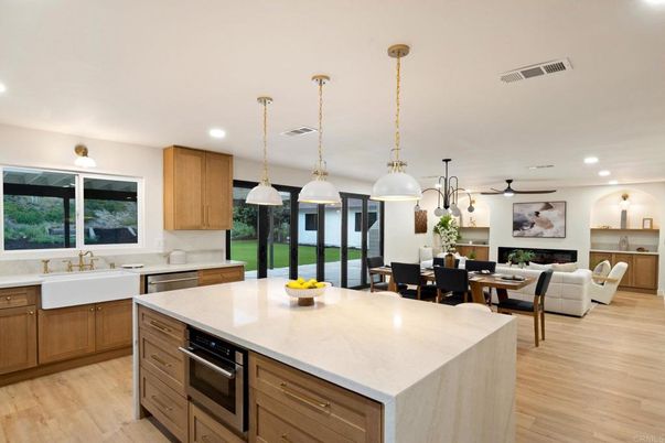 Dining room, Fireplace, Interior, Kitchen, Living room, Pendant Lights, Recessed Lighting, Stainless Steel Appliances, Wood Texture Flooring