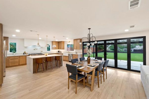 Chandelier, Dining room, Interior, Kitchen, Pendant Lights, Recessed Lighting, Stainless Steel Appliances, Wood Texture Flooring