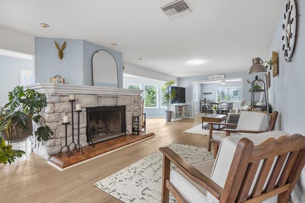 Dining room, Fireplace, Interior, Living room, Recessed Lighting, Wood Texture Flooring
