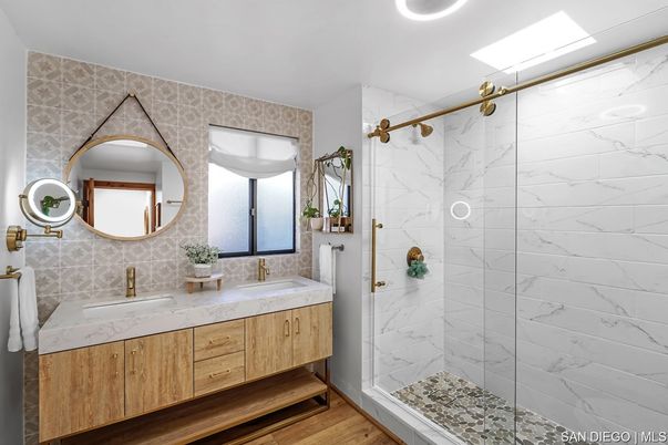 Bathroom, Dual Sink Vanities, Glass Shower, Interior, Marble Walls, Wood Texture Flooring