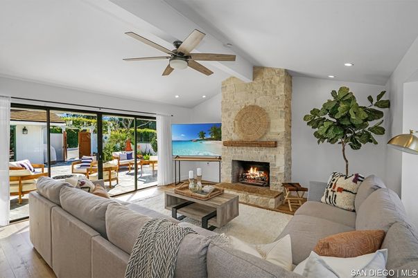 Dining room, Fireplace, Interior, Living room, Recessed Lighting, Stone Walls, Wood Texture Flooring