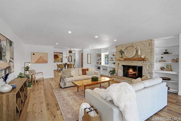 Chandelier, Dining room, Fireplace, Interior, Living room, Pendant Lights, Recessed Lighting, Stone Walls, Wood Texture Flooring