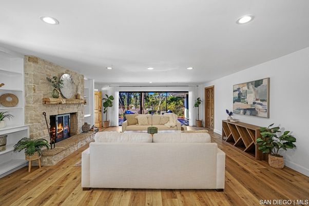 Fireplace, Interior, Living room, Recessed Lighting, Stone Walls, Wood Texture Flooring