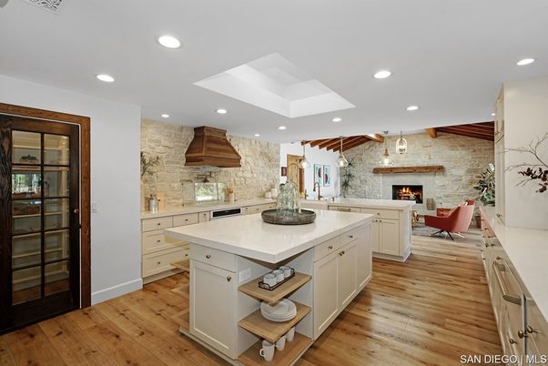Fireplace, Interior, Kitchen, Living room, Pendant Lights, Recessed Lighting, Stainless Steel Appliances, Stone Walls, Wood Texture Flooring