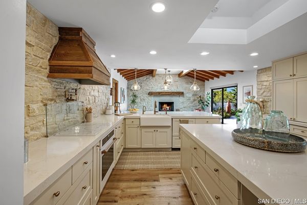 Fireplace, Interior, Kitchen, Pendant Lights, Recessed Lighting, Stainless Steel Appliances, Stone Walls, Wooden Beams, Wood Texture Flooring