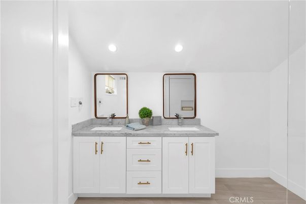 Bathroom, Dual Sink Vanities, Interior, Recessed Lighting, Wood Texture Flooring
