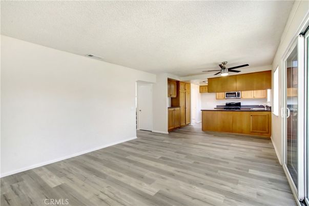 Empty room, Interior, Kitchen, Stainless Steel Appliances, Wood Texture Flooring