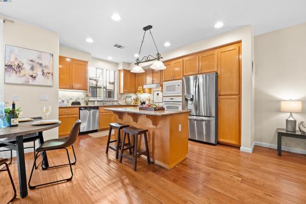 Dining room, Interior, Kitchen, Pendant Lights, Recessed Lighting, Stainless Steel Appliances, Wood Texture Flooring