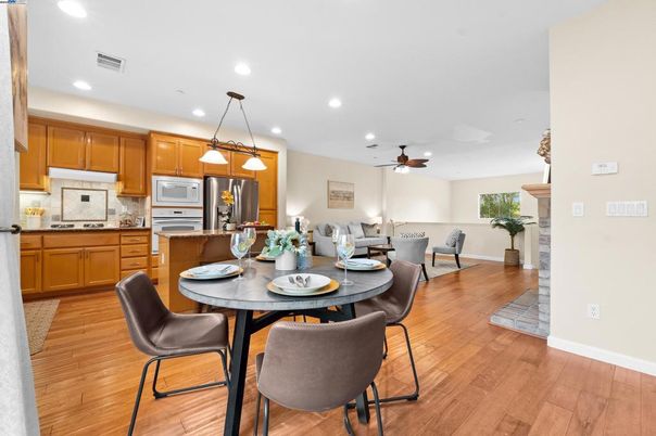 Dining room, Interior, Kitchen, Pendant Lights, Recessed Lighting, Stainless Steel Appliances, Wood Texture Flooring