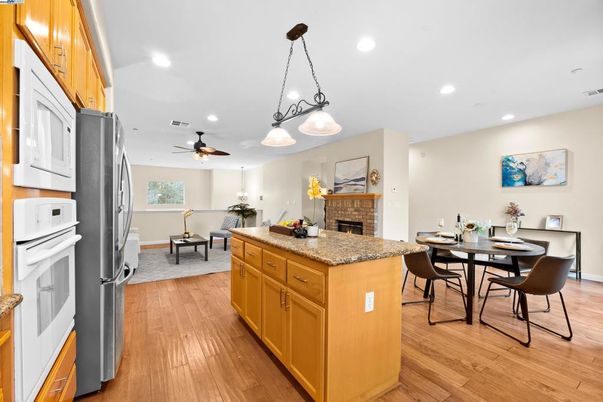 Dining room, Fireplace, Interior, Kitchen, Pendant Lights, Recessed Lighting, Wood Texture Flooring