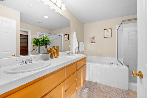 Bathroom, Dual Sink Vanities, Glass Shower, Interior, Recessed Lighting, Tile Countertops