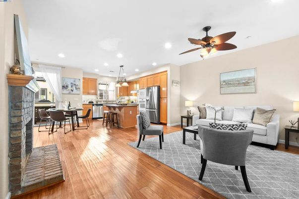 Dining room, Fireplace, Interior, Kitchen, Living room, Pendant Lights, Recessed Lighting, Stainless Steel Appliances, Wood Texture Flooring