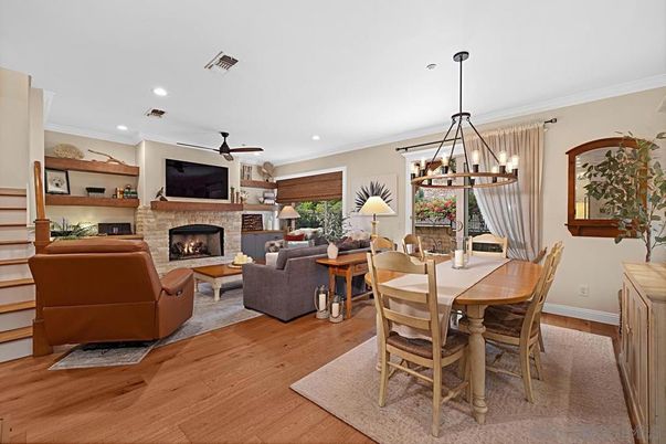 Dining room, Fireplace, Interior, Living room, Pendant Lights, Recessed Lighting, Wood Texture Flooring