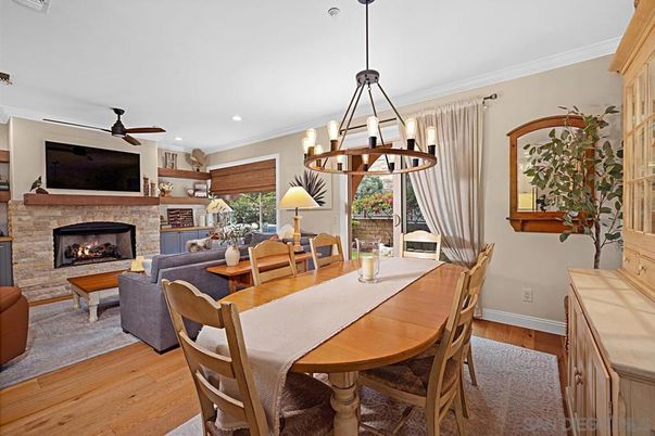 Chandelier, Dining room, Fireplace, Interior, Living room, Pendant Lights, Recessed Lighting, Wood Texture Flooring