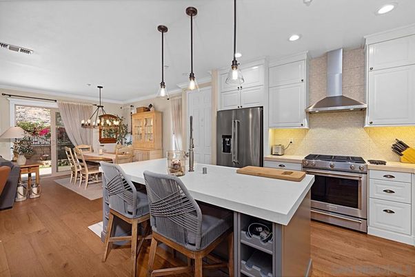 Chandelier, Dining room, Interior, Kitchen, Pendant Lights, Recessed Lighting, Stainless Steel Appliances, Wood Texture Flooring