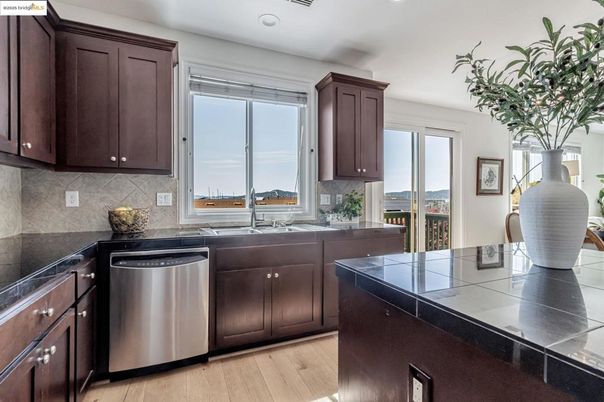Interior, Kitchen, Recessed Lighting, Stainless Steel Appliances, Tile Countertops, Wood Texture Flooring