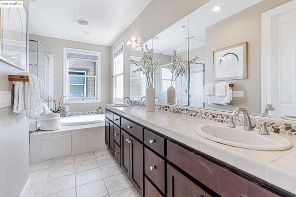 Bathroom, Dual Sink Vanities, Glass Shower, Interior, Recessed Lighting, Tile Countertops