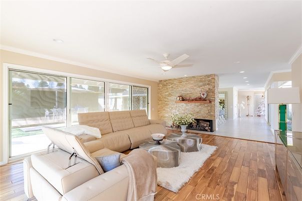 Fireplace, Interior, Living room, Recessed Lighting, Stone Walls, Wood Texture Flooring