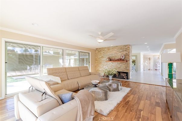 Fireplace, Interior, Living room, Recessed Lighting, Stone Walls, Wood Texture Flooring