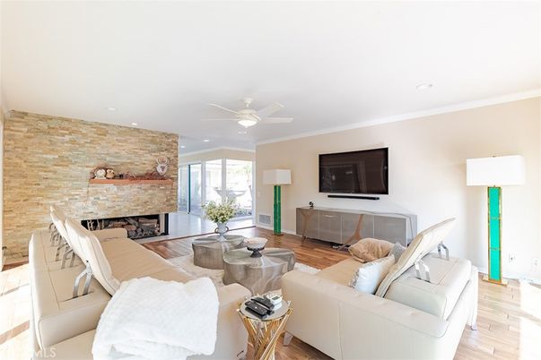 Fireplace, Interior, Living room, Recessed Lighting, Stone Walls, Wood Texture Flooring