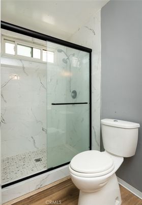 Bathroom, Glass Shower, Interior, Marble Walls, Wood Texture Flooring