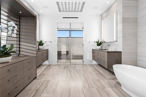 Bathroom, Dual Sink Vanities, Free Standing Baths, Glass Shower, Interior, Recessed Lighting, Wood Texture Flooring