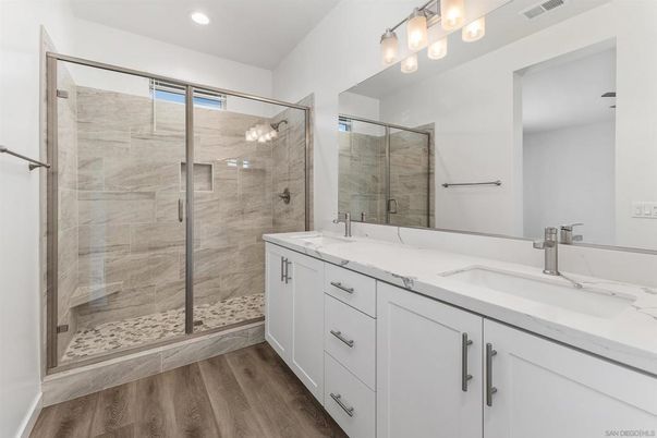 Bathroom, Dual Sink Vanities, Glass Shower, Interior, Recessed Lighting, Wood Texture Flooring
