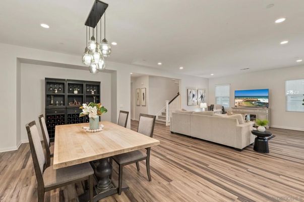 Dining room, Fireplace, Interior, Living room, Pendant Lights, Recessed Lighting, Wood Texture Flooring