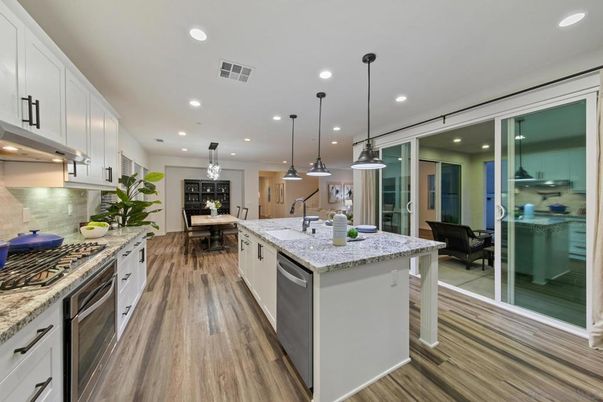 Dining room, Interior, Kitchen, Pendant Lights, Recessed Lighting, Stainless Steel Appliances, Wood Texture Flooring