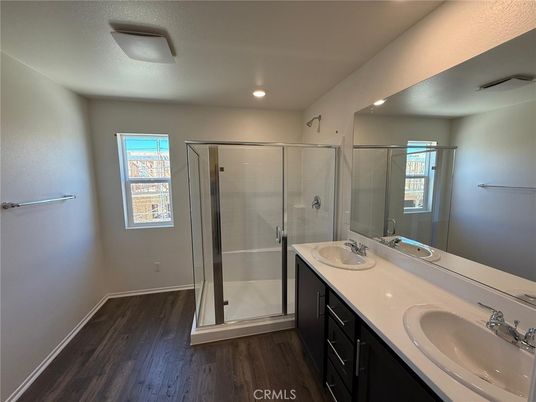 Bathroom, Dual Sink Vanities, Glass Shower, Interior, Recessed Lighting, Wood Texture Flooring
