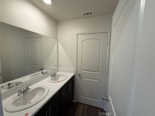 Bathroom, Dual Sink Vanities, Interior, Recessed Lighting, Wood Texture Flooring