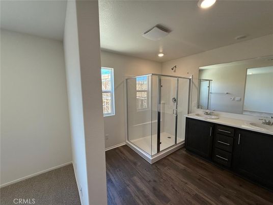 Bathroom, Dual Sink Vanities, Glass Shower, Interior, Recessed Lighting, Wood Texture Flooring