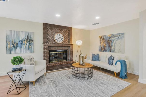 Fireplace, Interior, Living room, Recessed Lighting, Stone Walls, Wood Texture Flooring