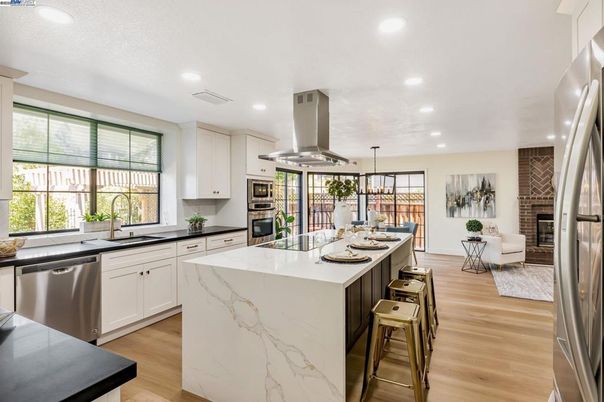 Dining room, Fireplace, Interior, Kitchen, Living room, Pendant Lights, Recessed Lighting, Stainless Steel Appliances, Wood Texture Flooring