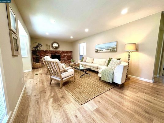 Fireplace, Interior, Living room, Recessed Lighting, Stone Walls, Wood Texture Flooring