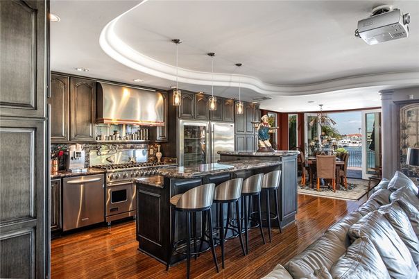 Dining room, Interior, Kitchen, Pendant Lights, Recessed Lighting, Stainless Steel Appliances, Wood Texture Flooring
