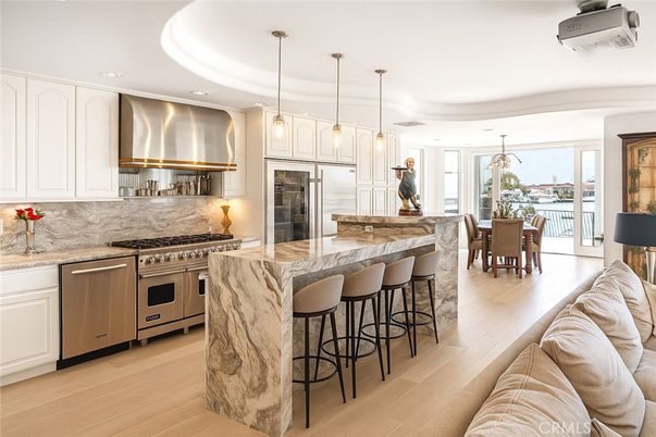Dining room, Interior, Kitchen, Pendant Lights, Recessed Lighting, Stainless Steel Appliances, Wood Texture Flooring