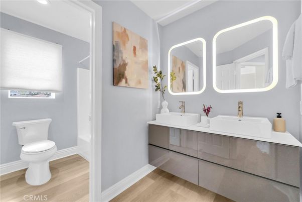 Bathroom, Dual Sink Vanities, Interior, Recessed Lighting, Wood Texture Flooring