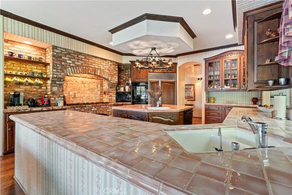 Interior, Kitchen, Pendant Lights, Recessed Lighting, Stone Walls, Tile Countertops, Wood Texture Flooring
