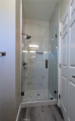 Bathroom, Glass Shower, Interior, Marble Walls, Wood Texture Flooring
