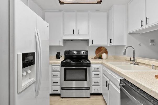 Interior, Kitchen, Stainless Steel Appliances, Tile Countertops, Wood Texture Flooring
