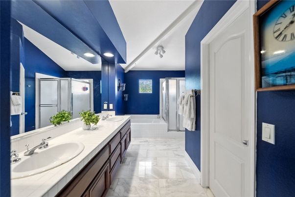 Bathroom, Dual Sink Vanities, Interior, Marble, Recessed Lighting, Tile Countertops