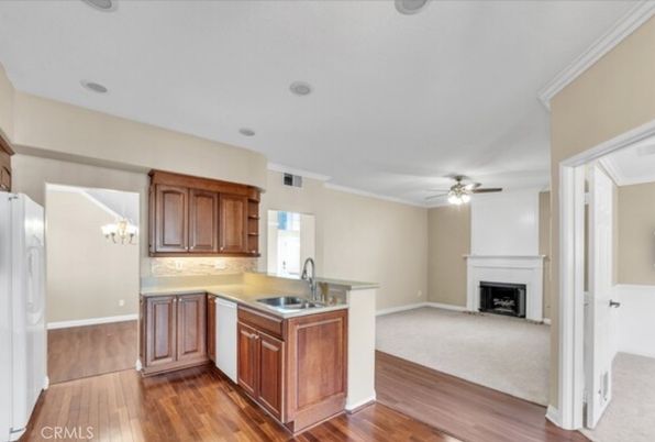 Chandelier, Fireplace, Interior, Kitchen, Recessed Lighting, Wood Texture Flooring