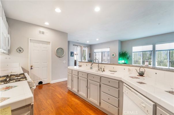 Interior, Kitchen, Recessed Lighting, Tile Countertops, Wood Texture Flooring