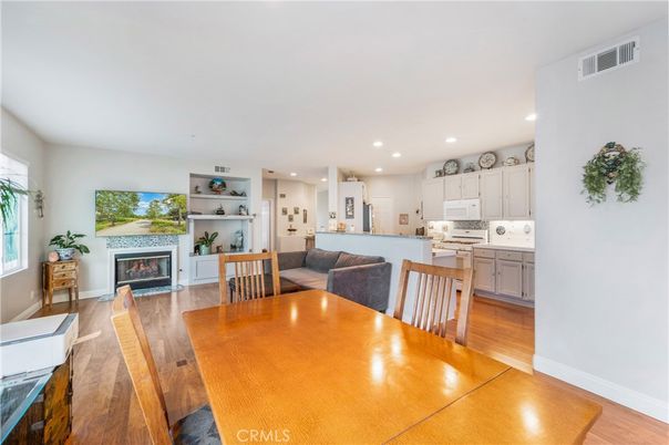 Dining room, Fireplace, Interior, Kitchen, Recessed Lighting, Wood Texture Flooring