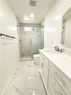 Bathroom, Dual Sink Vanities, Glass Shower, Interior, Marble, Marble Walls, Recessed Lighting